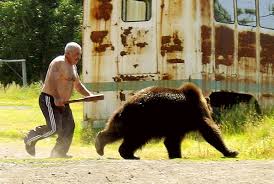 man chasing bear